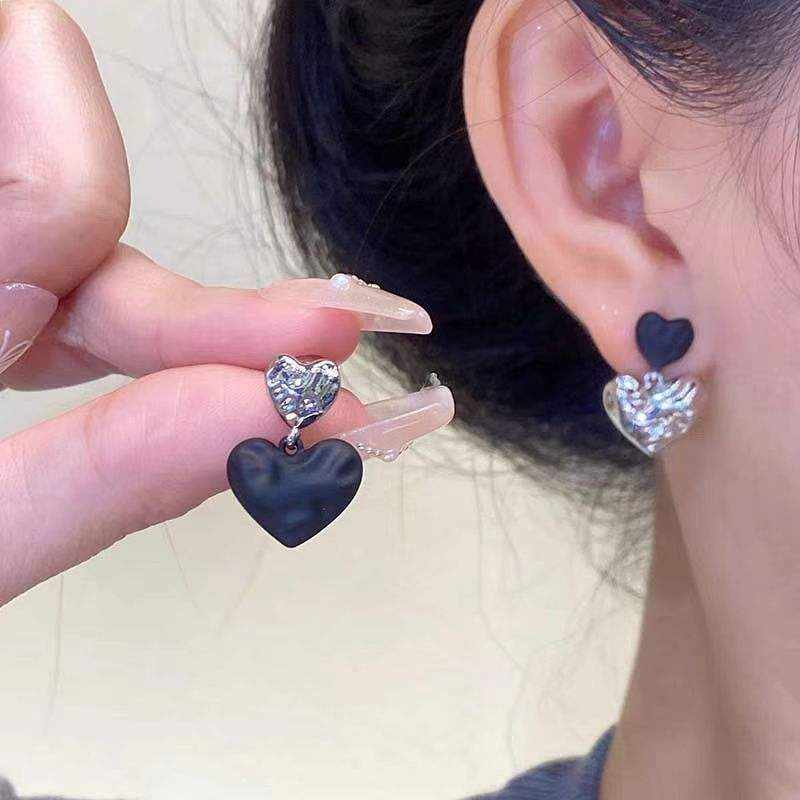 Black & silver double heart drop earrings with layered metallic hearts and matte black accents